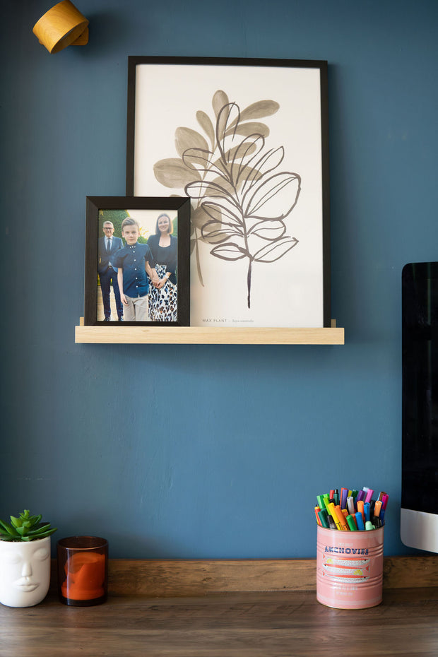 Example of our framed prints on a shelf